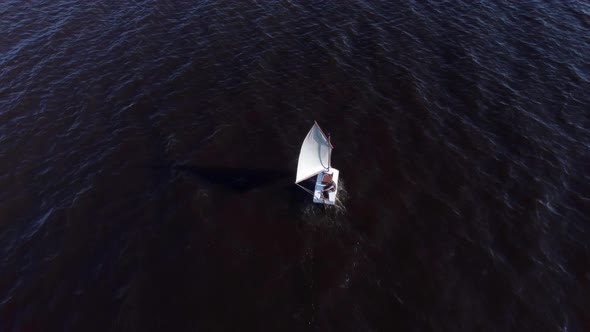 Flying Over a Boat with a Sail