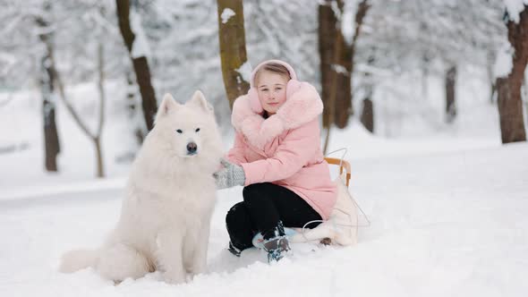 Girl with Dog in Winter