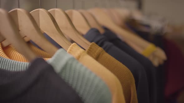 Colorful Jumpers on Hangers