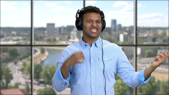 Cheerful Man Enjoy to Listening Music with Headphones