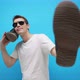 The guy is dancing and using a shoe instead of a phone. dance fitness. Negotiation. - VideoHive Item for Sale