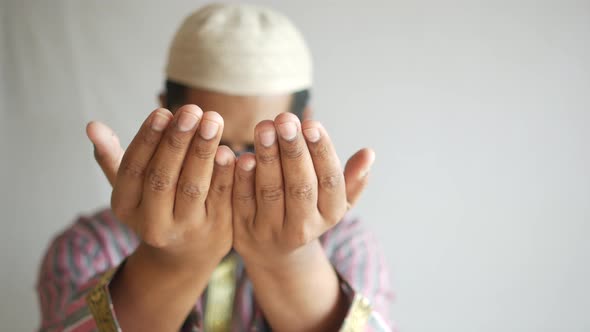 Muslim Man Keep Hand in Praying Gestures During Ramadan Close Up