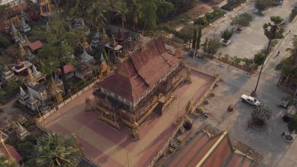 Smaller Pagoda view beside the Golden Temple of Phnom Penh in Cambodia - Aerial Orbit shot