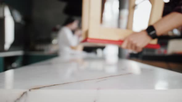 Close Up View of Coffee Shop Which is Closed Turn Off Lights and Put Chairs Upside Down on Table