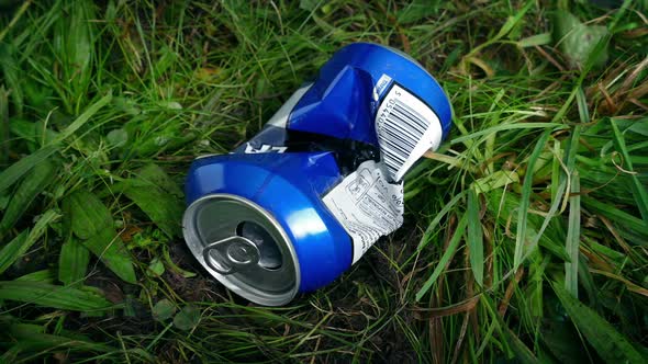 Can Thrown in Grass - Litter Concept