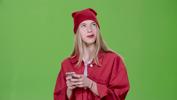 Teenager Prints a Message on the Phone. Green Screen. Slow Motion