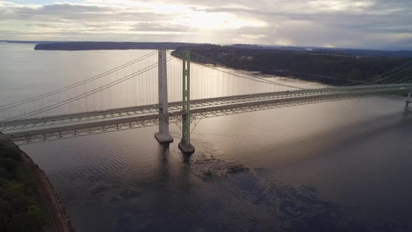 Wide establishing drone shot of the Tacoma Narrows Bridge, circa 2015.