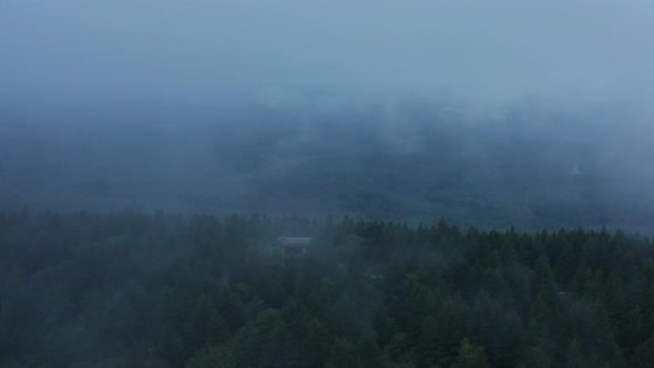 An aerial shot (dolly in) of the Seneca Creek Valley and the lookout tower on top of Spruce Knob, th