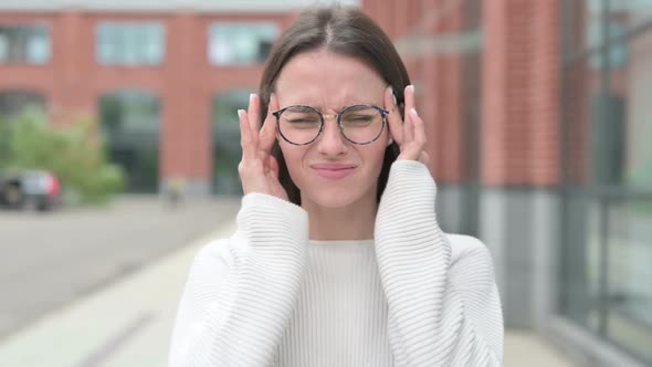 Tense Young Woman having Headache, Outdoor