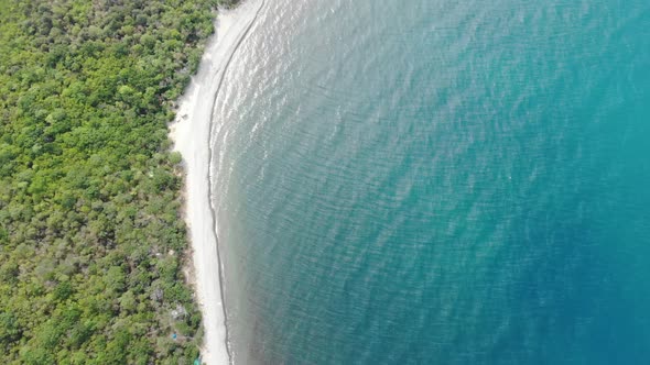 Flight Along the Coastline. Aerial Flight with Drone DJI Over Beautiful Green Mountains and White