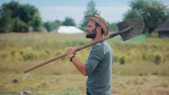 Agronomist With Shovel On Field. Farmer Cultivate Vegetables Farm. Farmland Plantation Agricultural.