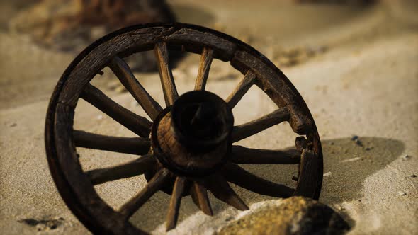 Large Wooden Wheel in the Sand alt