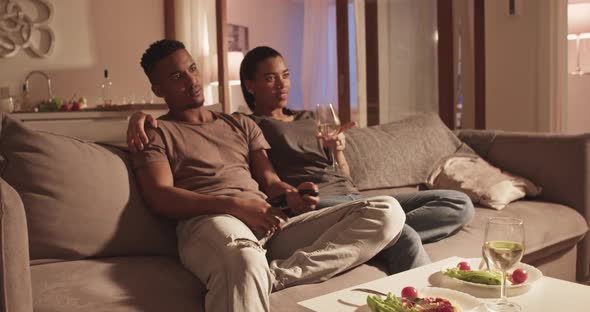 Diverse Couple Watching TV During Date