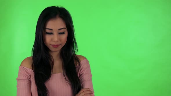 Young Attractive Asian Woman Agrees (Move with Head on Yes) - Green Screen Studio