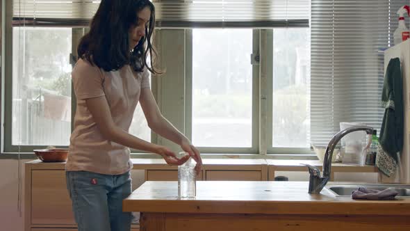 Corona pandemic - Girl using hand sanitizer to prevent coronavirus spread