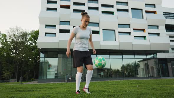 Portrait of Woman Footballer Player in Full Growth in the Park