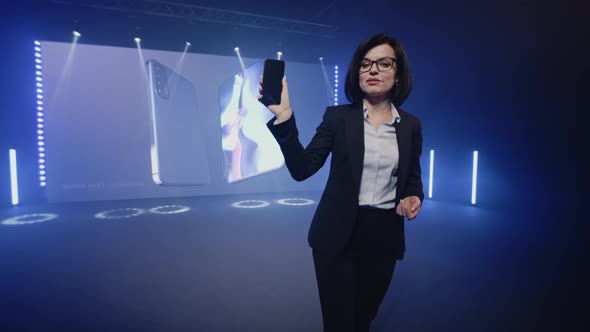The Presenter Holding a New Smartphone