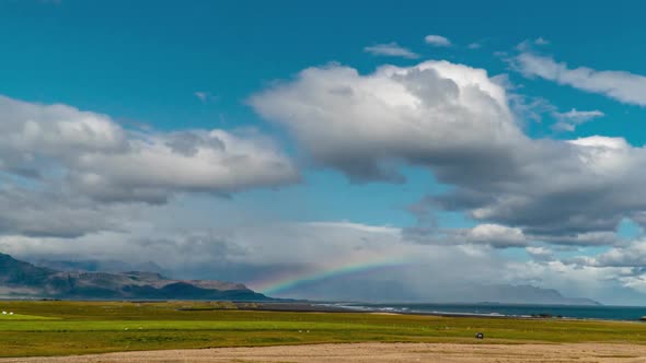 Clouds and Rainbow Over the Coast of Iceland