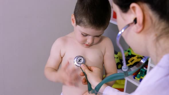Pediatric Examination of a Child with a Stethoscope