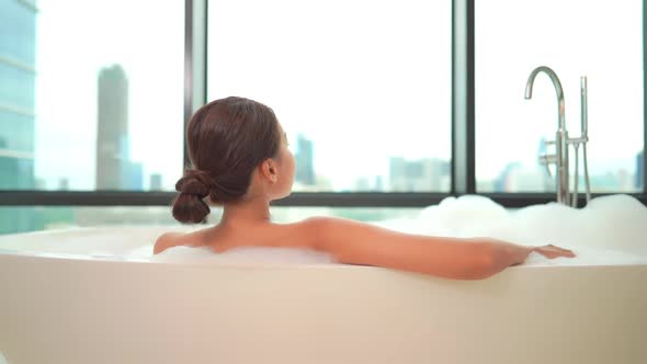 Young asian woman relax in bathtub