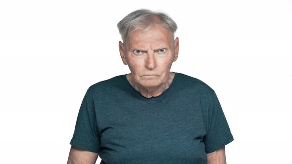 Portrait of Dissatisfied Old Aged Man 80s Having Gray Hair in Basic Tshirt Posing with Strict Gaze