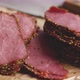 Delicious Peppered Roast Beef Pastrami Slices on Paper with Grains of Coloured Pepper - VideoHive Item for Sale