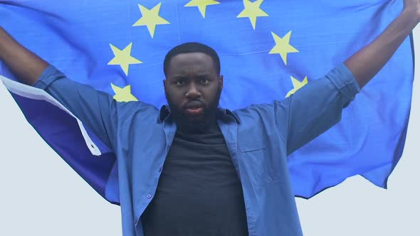 African-American Man Waving Flag of European Union, Human Right, Racial Equality