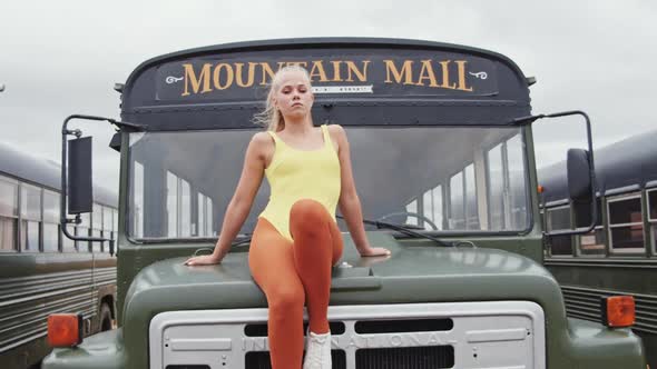 Cool Dancer In Yellow Leotard Sitting On Bus