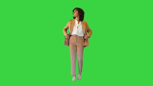 Young African American Girl Walking and Sightseeing on a Green Screen Chroma Key