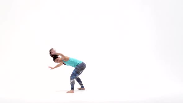 Females Is Practicing Capoeira in White Background of Studio. Afro-Brazilian Martial Art That