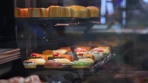 Storefront with Cupcakes and Puddings Covered with Icing