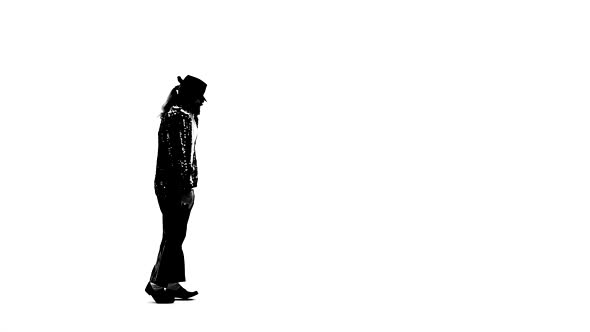 Silhouette of a Young Man Dancer Dancing in Style Michael Jackson on White Background. Close Up