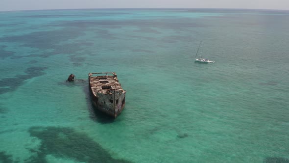 Sailboat Adrift Near The Sapona Shipwreck On The Caribbean Shore Of Bimini Island In The Bahamas. ae
