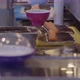 Cooking Delicious Sushi on Table Near Plates on Conveyor - VideoHive Item for Sale