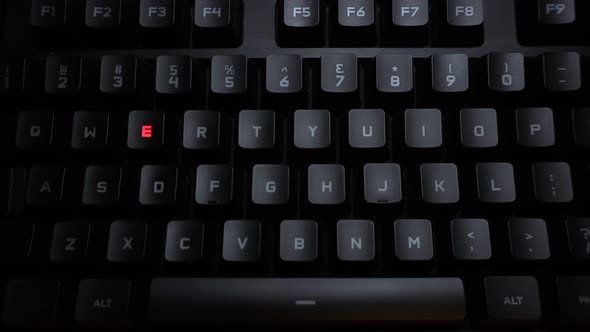 The Word Record Is Typed on a Luminous Computer Keyboard. Black Backlit Keyboard with Letters. The