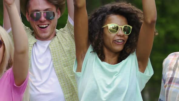 Young People Dancing, Waving Hands at Music Festival, Summertime, Lifestyle