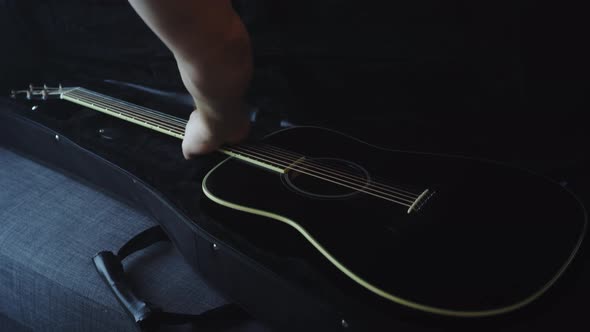 Black musical cover on a gray sofa