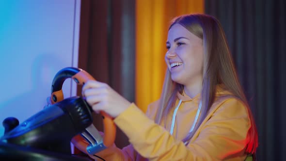 Portrait of a girl enjoying game on a computer. 