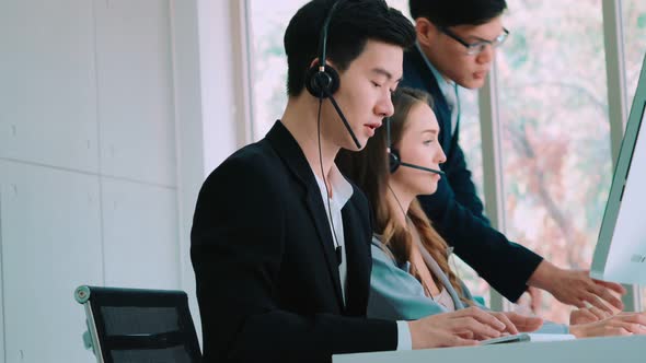 Business People Wearing Headset Working in Office