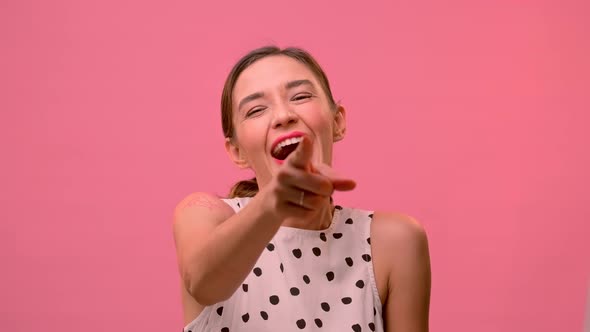 Woman Is Sincerely Happy for Her Friend on a Pink Background.