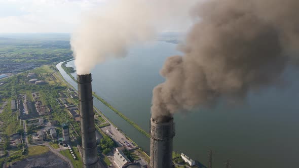 Aerial View of Coal Power Plant High Pipes with Black Smokestack Polluting Atmosphere