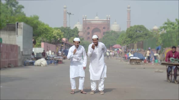 Two muslim men doing adaab at Jama Masjid Delhi