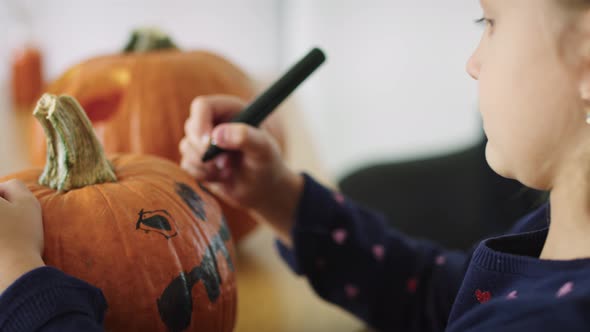 Girl making decorations for Halloween