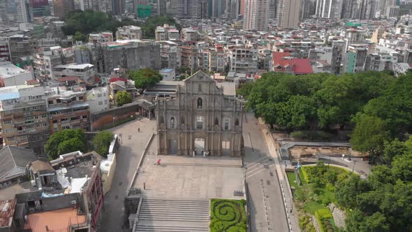 Orbiting aerial view of famous Ruins of Saint Paul's, Macau on sunny day