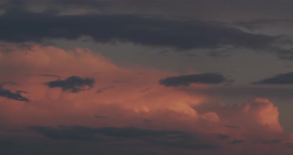 Accelerated Movement Of Pink And Blue Clouds At Sunset