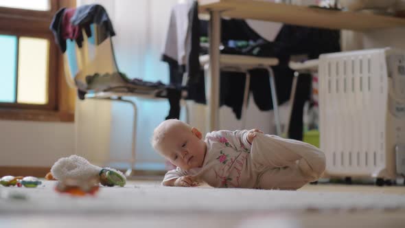 Eight Months Child on the Floor at Home