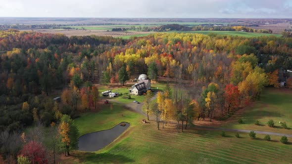 beautiful home property surrounded by fall colors