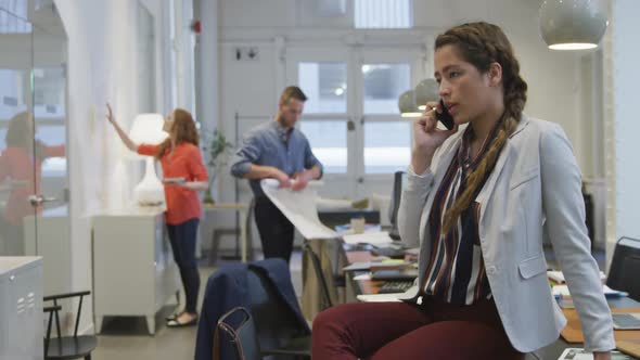 Businesswoman on the phone in modern office