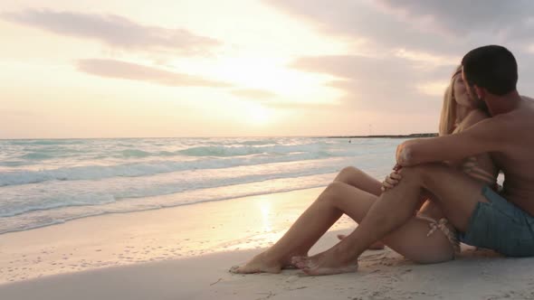 Young Man Woman Couple in Love Enjoys Sunrise or Sunset on Ocean Beach Seaside in Summer Gimbal