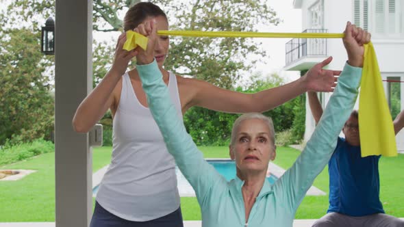 Senior couple exercising in a garden